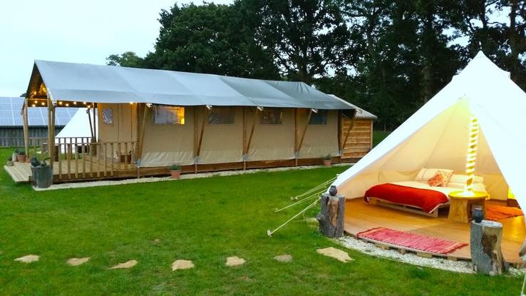 Safari tent with extra bell tents at Campfires & Stars, a glamping site in the Cotswolds, Oxfordshire