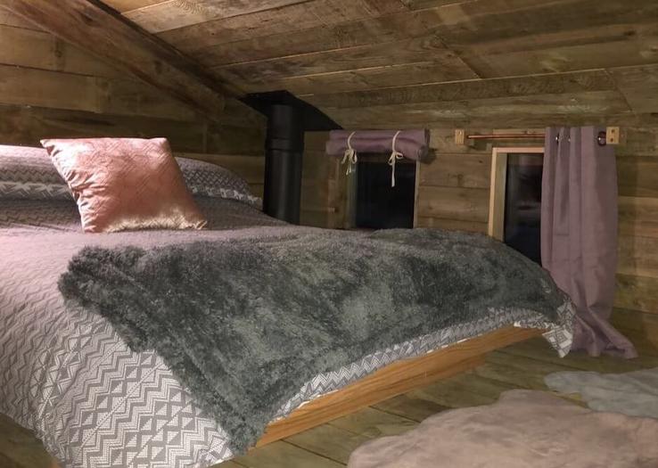 Loft bed in cabin at Campfires & Stars, a glamping site in the Cotswolds, Oxfordshire