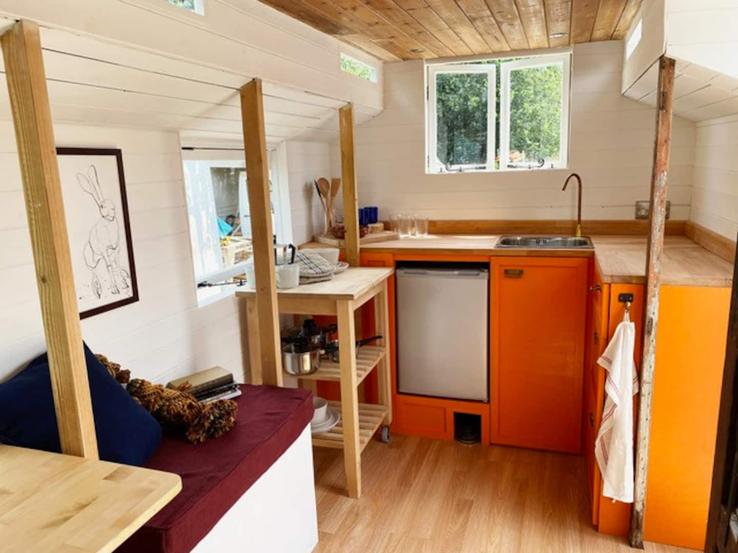 The kitchen in the showman's wagon at Campfires & Stars, a glamping site in the Cotswolds, Oxfordshire